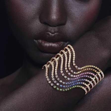 Hermès editorial reference: colorful jeweled cuff in a close-up portrait