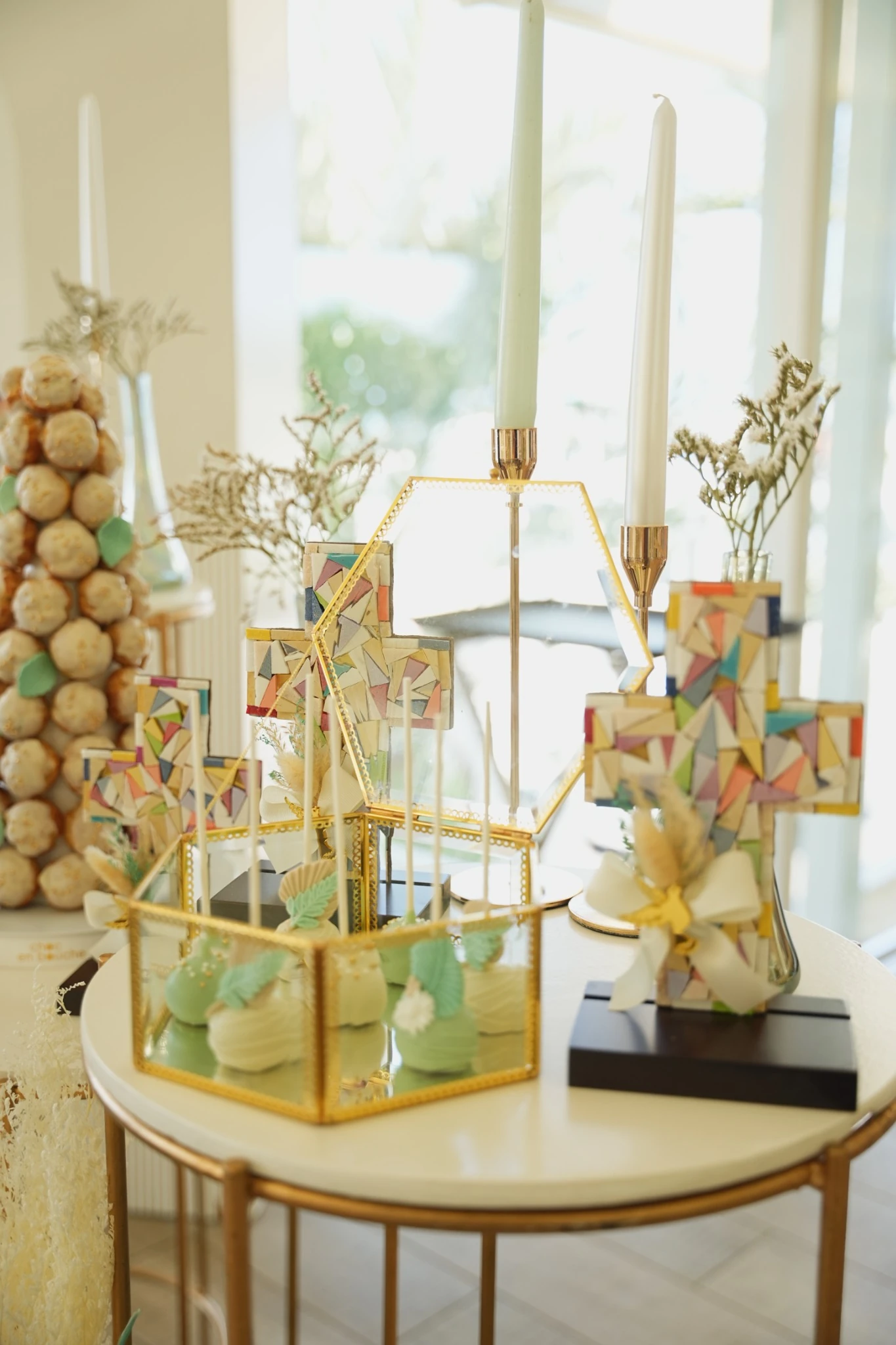 Baptism dessert display featuring handmade decorative crosses