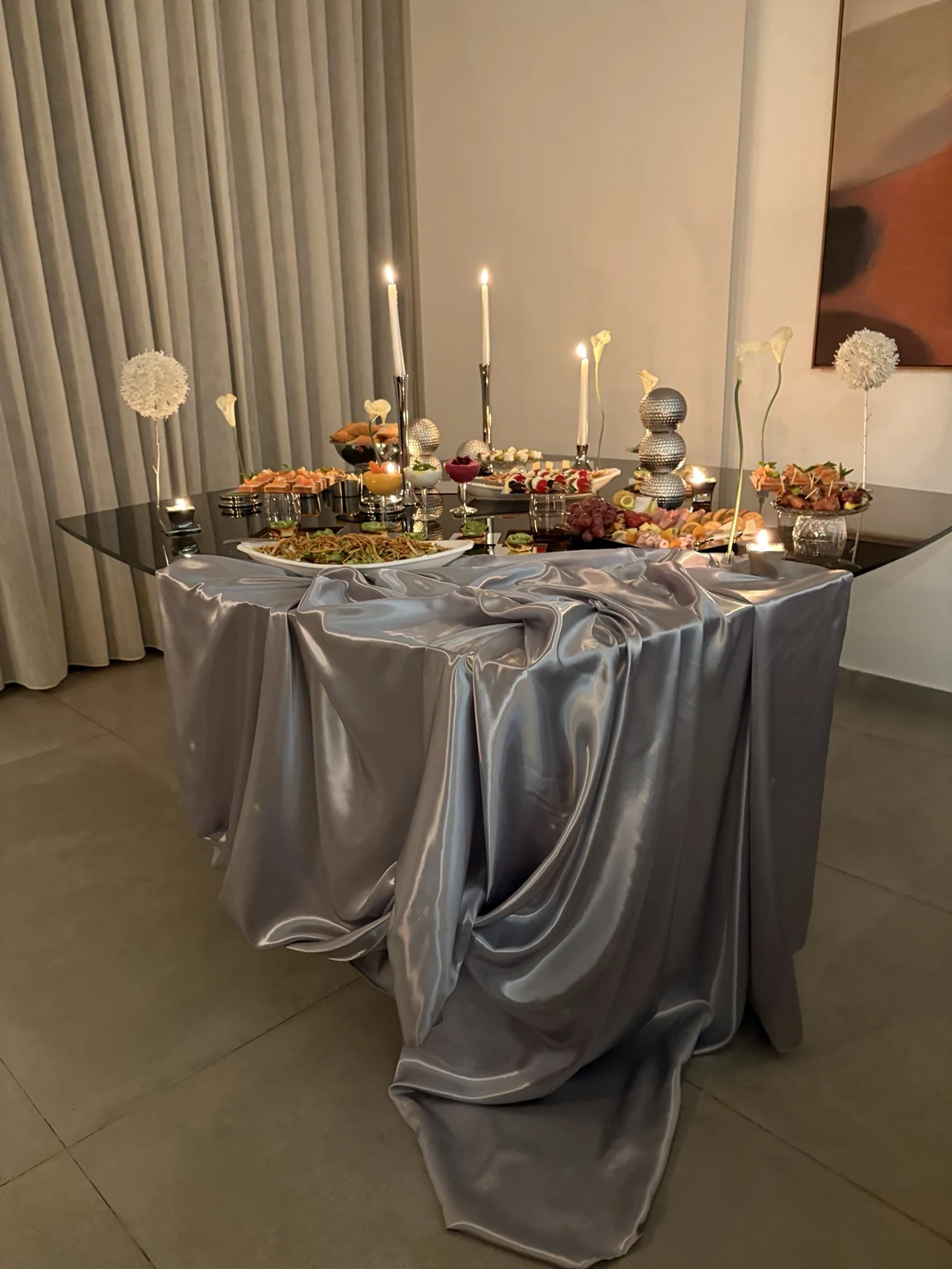 A Metallic Buffet with sculptural silver draping and styling