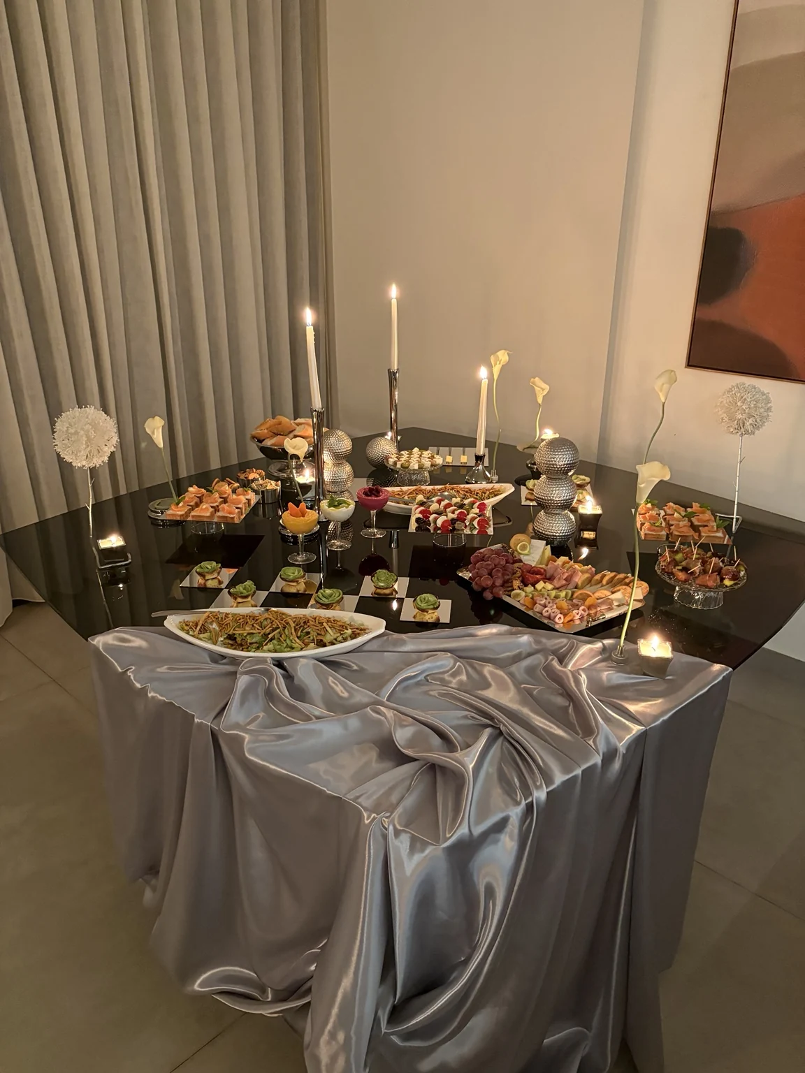 Overhead view of the buffet with silver decorations and balanced food presentation